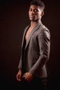 Handsome muscular Afro young man in classical jacket on naked torso Royalty Free Stock Photo