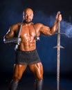 Handsome muscular ancient warrior with a sword Royalty Free Stock Photo