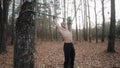 Handsome athlete does an upside-down on the horizontal bar. callisthenics. Guy doing exercises. average view