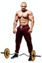 Handsome muscular bodybuilder preparing for fitness training. Royalty Free Stock Photo