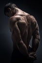 Handsome muscular bodybuilder turned back Royalty Free Stock Photo