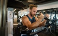 Handsome muscular man working out hard at gym Royalty Free Stock Photo