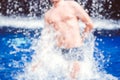Handsome muscular guy jumping from water blurred bokeh background Royalty Free Stock Photo