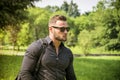 Handsome Muscular Hunk Man Outdoor in City Park Royalty Free Stock Photo