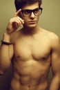 Handsome muscular male model with nice body wearing eyewear Royalty Free Stock Photo
