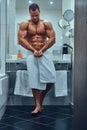 A handsome muscular male in stylish twin bathroom.