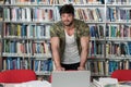 Muscular College Student in a Library Royalty Free Stock Photo