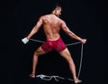 Handsome Muscular Man displays ancient Asian traditional martial arts, Thai Boxing or Muay Thai Royalty Free Stock Photo