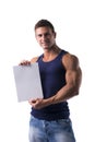 Handsome muscular man holding a blank sign Royalty Free Stock Photo