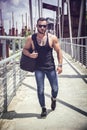 Handsome muscular man standing outdoor in city