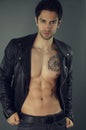 Handsome muscular man wearing a black leather jacket Royalty Free Stock Photo