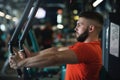 Handsome muscular man working out hard at gym. Chest workouts Royalty Free Stock Photo