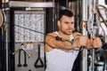 Handsome muscular man working out hard at gym Royalty Free Stock Photo