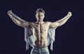 Handsome muscular shirtless young man holding shirt Royalty Free Stock Photo