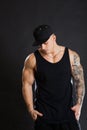 Handsome muscular tattooed man in black outfit. Royalty Free Stock Photo