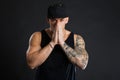 Handsome muscular tattooed man in black outfit. Royalty Free Stock Photo