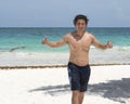 Handsome muscular young Amerasian man on the beach