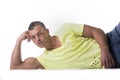 Handsome, muscular young man leaning on the floor Royalty Free Stock Photo