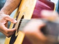 handsome musician playing acoustic guitar on blur background. World music day. music and instrument concept. Royalty Free Stock Photo