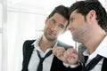 Handsome narcissistic young man in a mirror Royalty Free Stock Photo