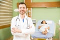 Handsome obgyn in a hospital room Royalty Free Stock Photo