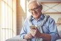 Handsome old man at home Royalty Free Stock Photo