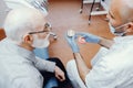 Old man sitting in the dentist`s office