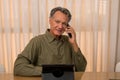 Handsome Older Gentleman Working in his Home Office Royalty Free Stock Photo