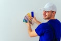 Handsome Painter Holding Color Guide