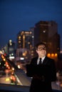 Handsome Persian businessman against view of the city at night Royalty Free Stock Photo