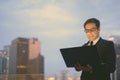 Handsome Persian businessman against view of the city at night Royalty Free Stock Photo