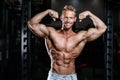 Handsome power athletic man on diet training pumping up muscles Royalty Free Stock Photo