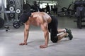 Handsome powerful athletic man preparing for performing push ups