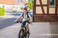 Handsome preteen boy going to school on bike. Teenager ride bicycle. Safe way to high school. Happy child boy with