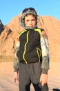 Handsome preteen boy on safari trip in the egyptian desert