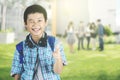 Handsome preteen student winking in the park