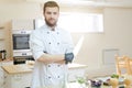 Handsome Professional Chef Posing in Kitchen Royalty Free Stock Photo