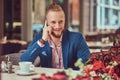 A handsome redhead businessman with a stylish haircut and beard