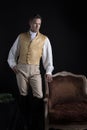 A handsome Regency gentleman wearing a gold waistcoat