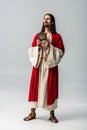 Religious man holding holy bible on grey Royalty Free Stock Photo