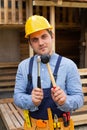 Handsome repairman holding tools Royalty Free Stock Photo