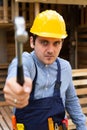 Handsome repairman holding tools Royalty Free Stock Photo