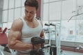 Muscular man working out at the gym