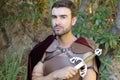 Handsome Roman soldier holding a sword Royalty Free Stock Photo