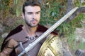 Handsome Roman soldier holding a sword Royalty Free Stock Photo