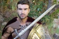 Handsome Roman soldier holding a sword Royalty Free Stock Photo