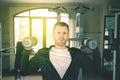 Handsome 40s caucasian man lifting weights at gym Royalty Free Stock Photo