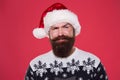 Handsome Santa. Bearded hipster looking confident Santa claus hat. Winter holidays. Naughty. Brutal attractive Santa