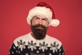 Handsome Santa. Bearded hipster looking confident Santa claus hat. Winter holidays. Naughty. Brutal attractive Santa