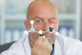 handsome scientist making research over dna molecule structure Royalty Free Stock Photo